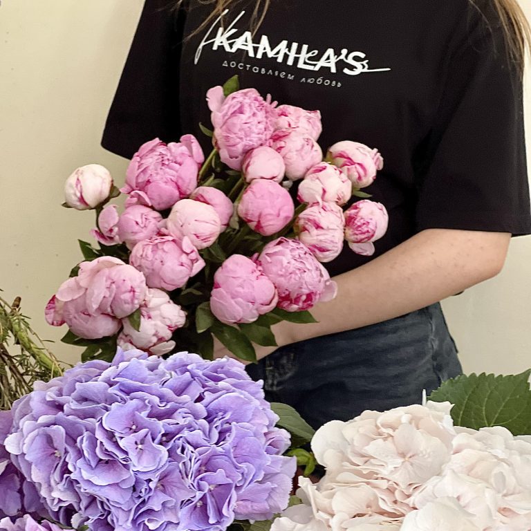 Kamila's florist with a bouquet